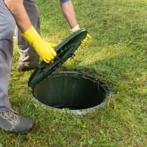 opening a septic tank for inspection and service