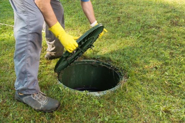opening a septic tank for inspection and service